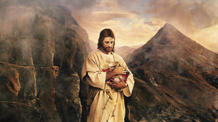 Jesus Christ holding McDonald's and Coca-Cola in mountains