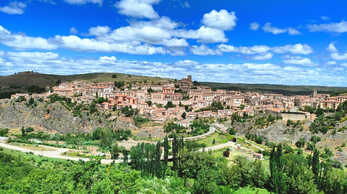 Sepulveda village on a hill under a cloudy blue sky
