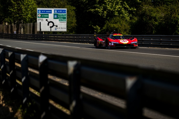 Ferrari 499P racing car on a road