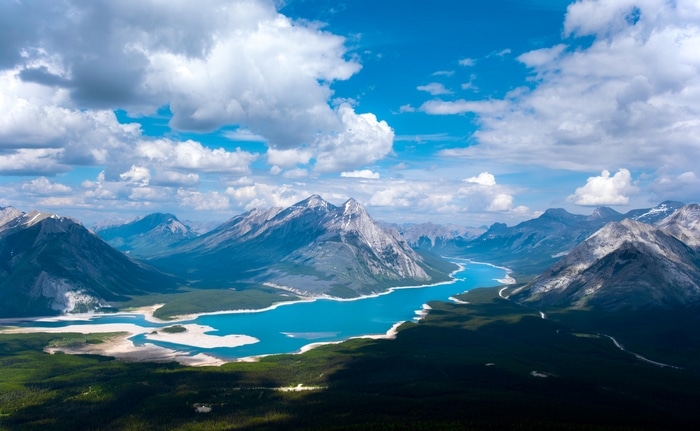 4K aerial view of a lake and mountains in Canada