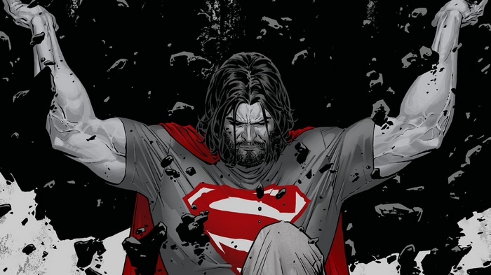 Superman with a beard holding debris
