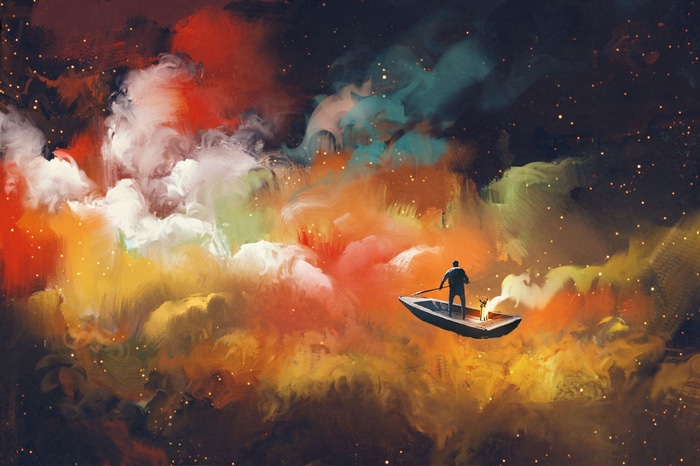 Man in boat with lantern in colorful nebula