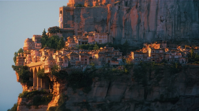 City built on a cliffside with ancient architecture