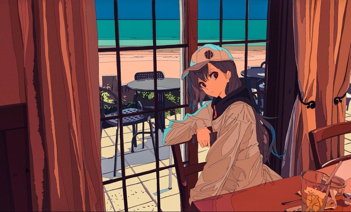 Girl in hat at a cafe by the sea