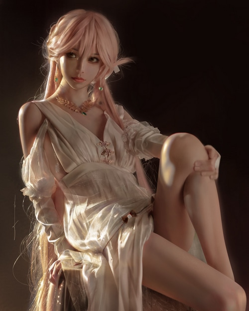 Woman in white dress with pink hair