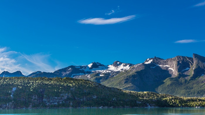 Snow-capped mountains over a fjord in Norway