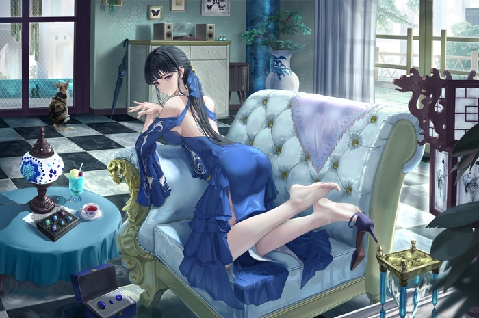 Woman in Blue Dress on Couch with Cat
