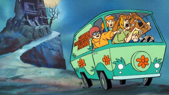 Scooby-Doo gang in the Mystery Machine near a haunted mansion