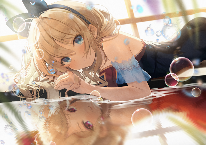 Girl with blonde hair and blue eyes with bubbles