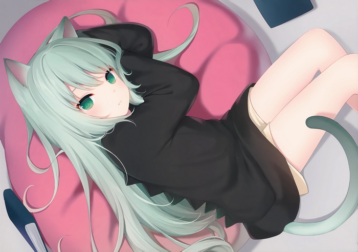 Cat girl lying on a pink pillow