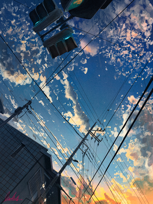 Traffic Lights and Telephone Poles Against a Sunset Sky