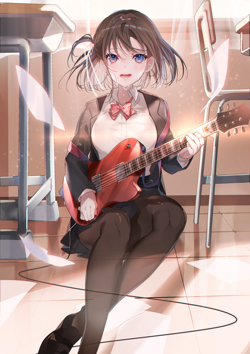 Schoolgirl playing a guitar in a classroom