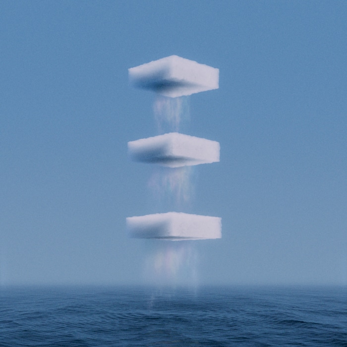 Three cube clouds over the ocean