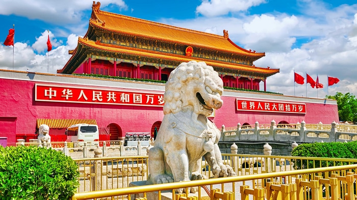 Tiananmen Square with Lion Statue and Chinese Flags