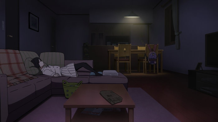 Naruse Jun lying on a couch in a dimly lit room