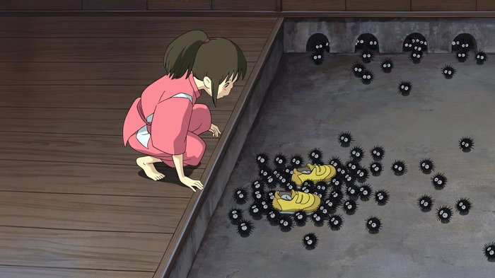 Chihiro and Susuwatari in Spirited Away
