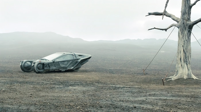 Spinner vehicle in a desolate landscape with a dead tree