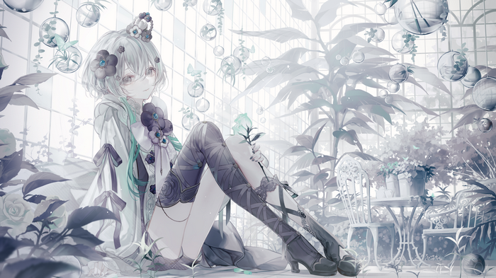 Girl with flowers in hair in a greenhouse with plants