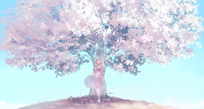 Girl in pink dress under a blooming cherry blossom tree