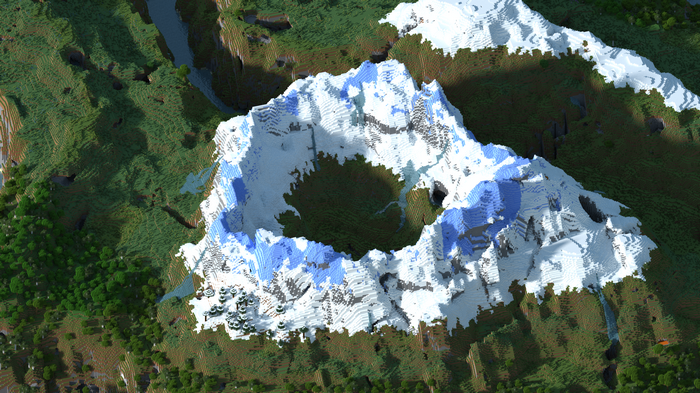 Minecraft snowy mountain crater with green landscape