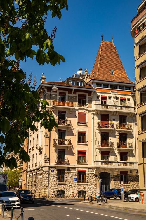 Apartment buildings with a distinctive mansard roof on a sunny day