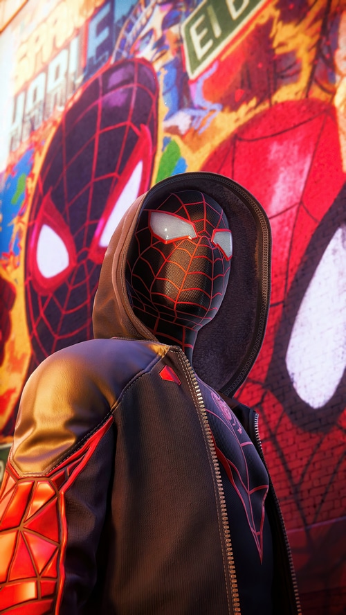 Miles Morales Spider-Man in front of graffiti