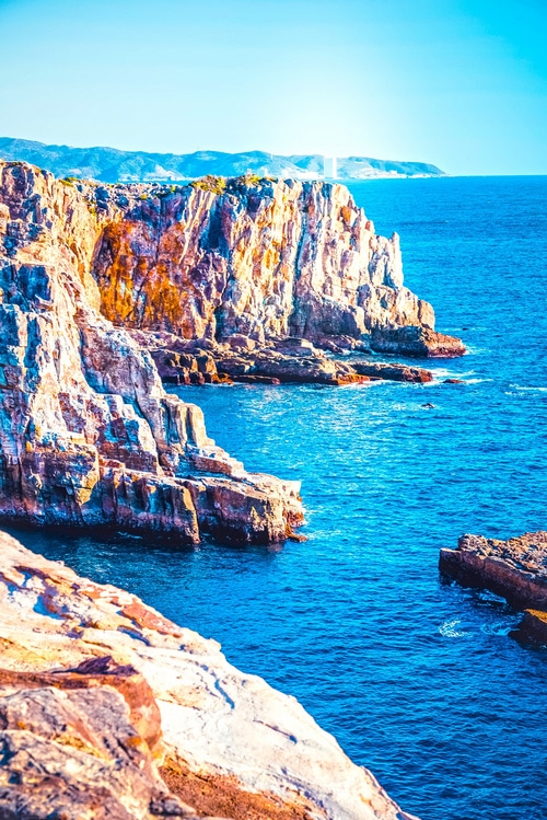 Rocky coast overlooking a bright blue sea