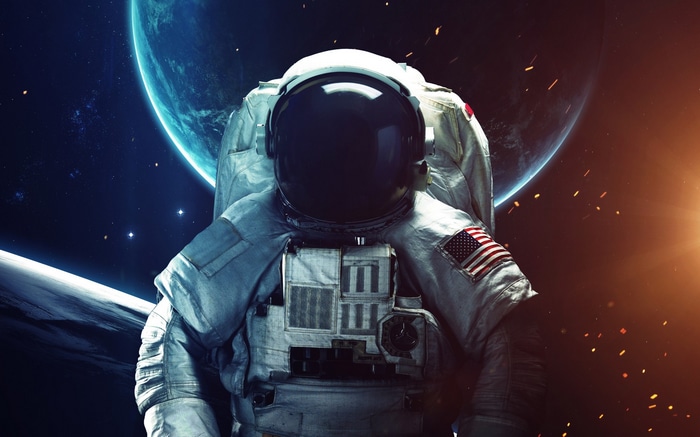 Astronaut in space with a planet in the background