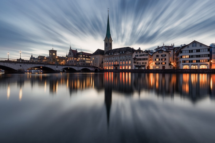 Zurich cityscape with river and long exposure clouds