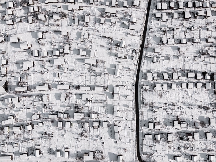 Aerial view of Zurich in winter with snow-covered houses
