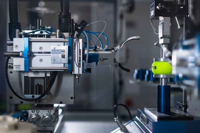 Automated machine testing a tennis ball