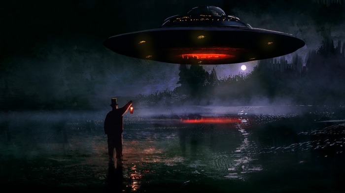 UFO hovering over a man with a lantern