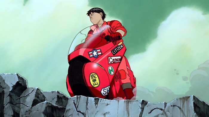 Shotaro Kaneda riding his red motorcycle