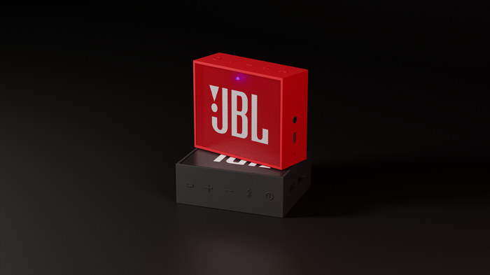 Red JBL speaker on a black JBL speaker