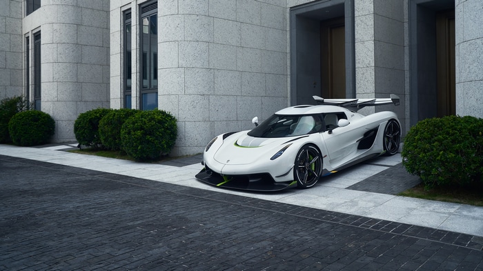 White Koenigsegg Jesko supercar parked near a building