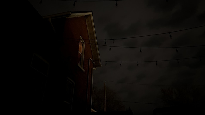 4K spooky house at night with string lights