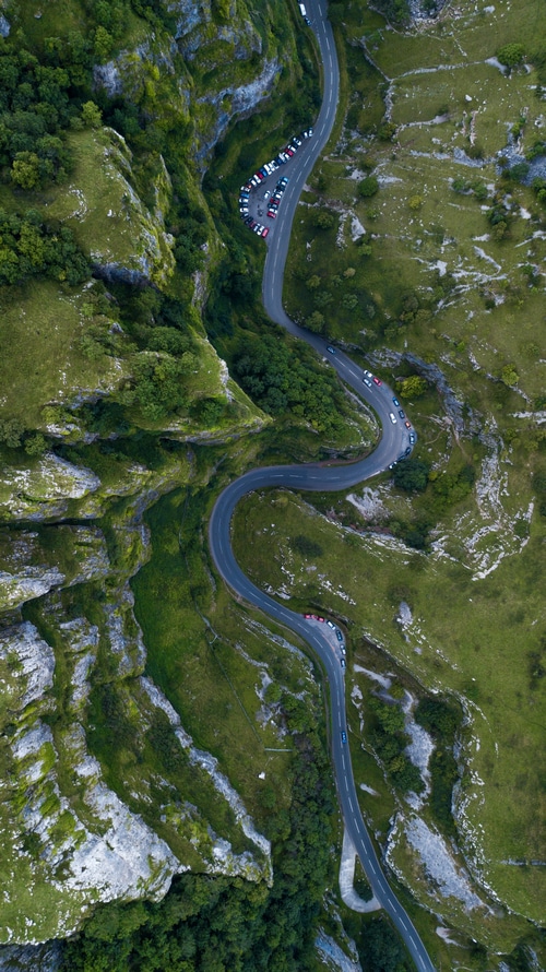 Aerial view of a winding road through a gorge in England