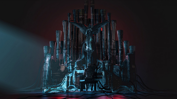 Angel statue on a pipe organ with a person playing
