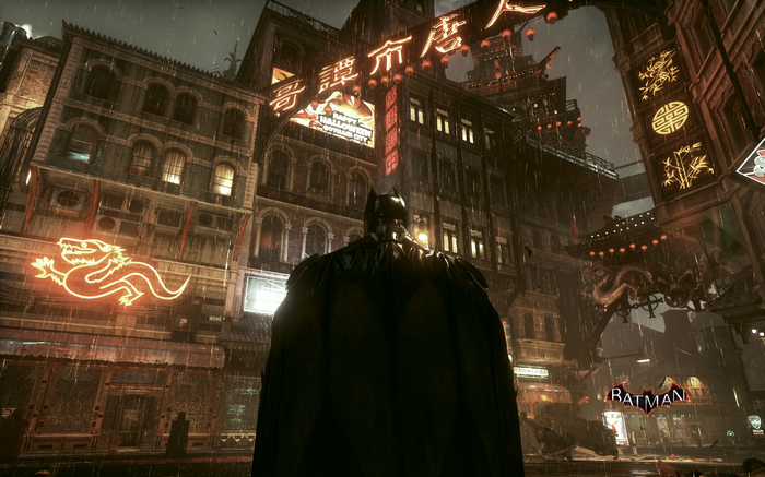 Batman in a rainy Gotham City at night