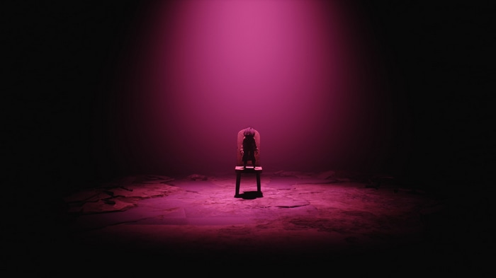 Mono on a chair under pink light