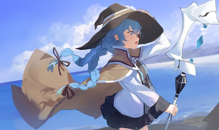 Roxy Migurdia with a staff on a windy beach