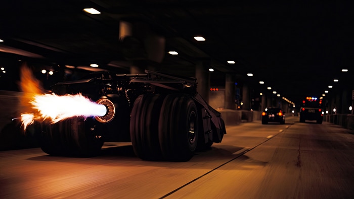 The Batmobile with flames shooting from its rear