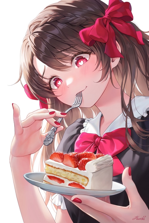 Girl with red bow eating strawberry cake