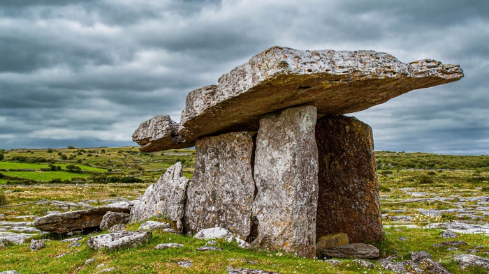 Poulnabrone Dolmen in Ireland under cloudy sky