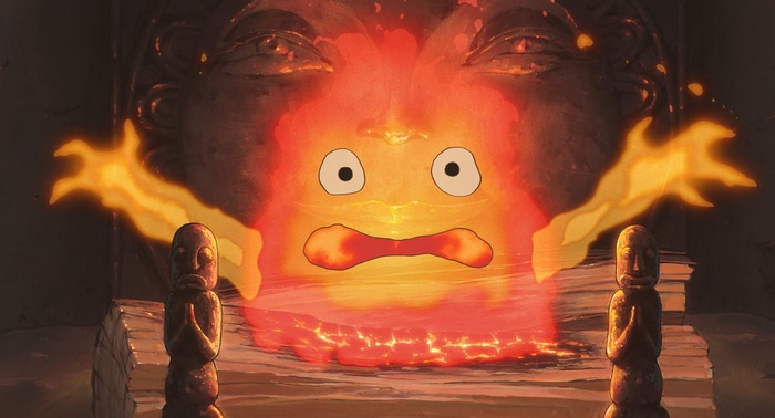 Calcifer from Howl's Moving Castle in front of a stone face
