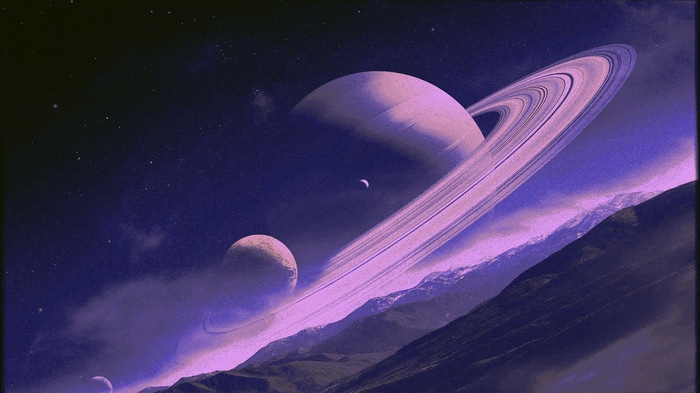 Saturn and moons in a purple starry sky