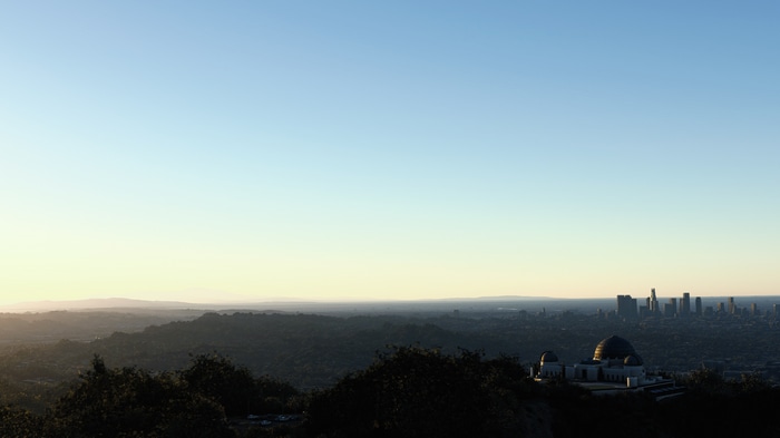 4K Griffith Observatory overlooking Los Angeles at sunset