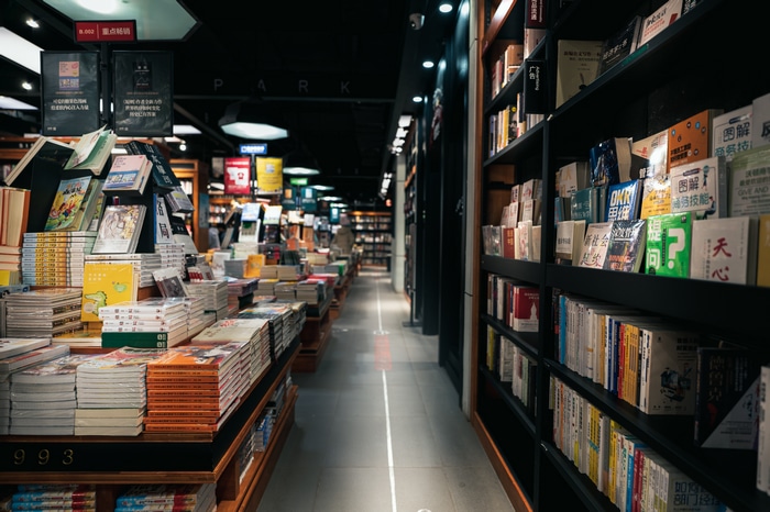 Bookstore aisle with shelves of books