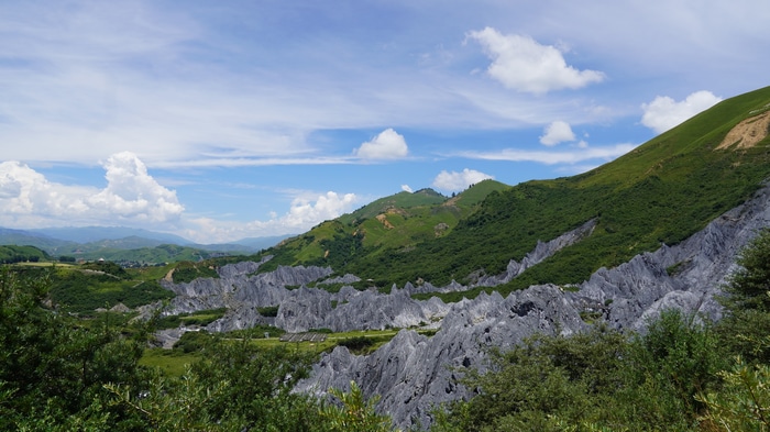 4K clouds over mountains and karst landscape