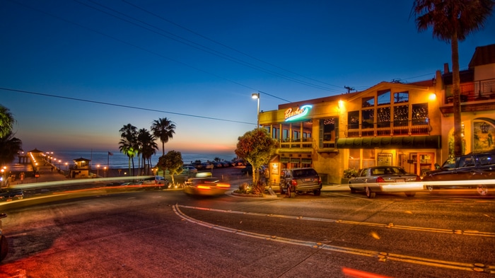 Beachside restaurant and pier at dusk